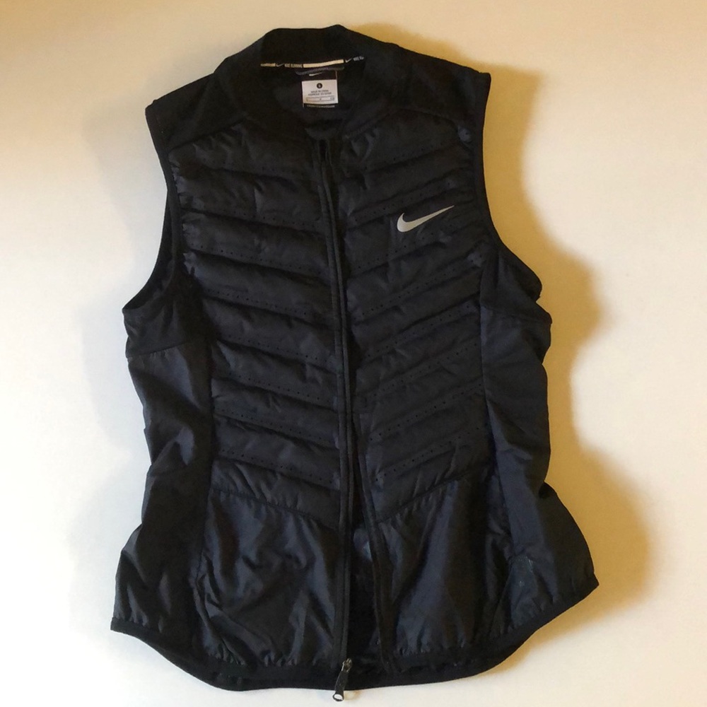 Nike woman running vest, lightly used.